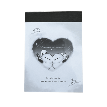 Front cover of a Crux Shimaenaga mini memo pad featuring two fluffy long-tailed tit birds leaning against each other inside a heart-shaped frame on a wintery background, with the text 'Happiness is just around the corner.