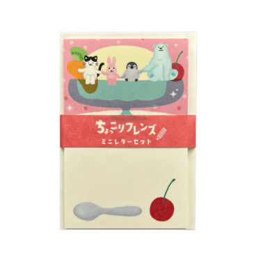 Front view of the World Craft Cute Animals mini letter set displaying writing paper illustrated with animals sitting in a parfait glass and a red belly band with Japanese text.