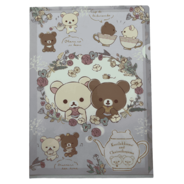 Front of a lavender San-X A4 clear folder featuring Korilakkuma and Chairoikoguma framed inside a floral wreath eating treats, surrounded by teacups and a teapot illustration.